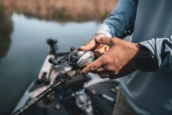 Quantum Energy S3 Baitcasting Reel -Sport Fishing Shop energy bc reel and rod closeup lifestyle